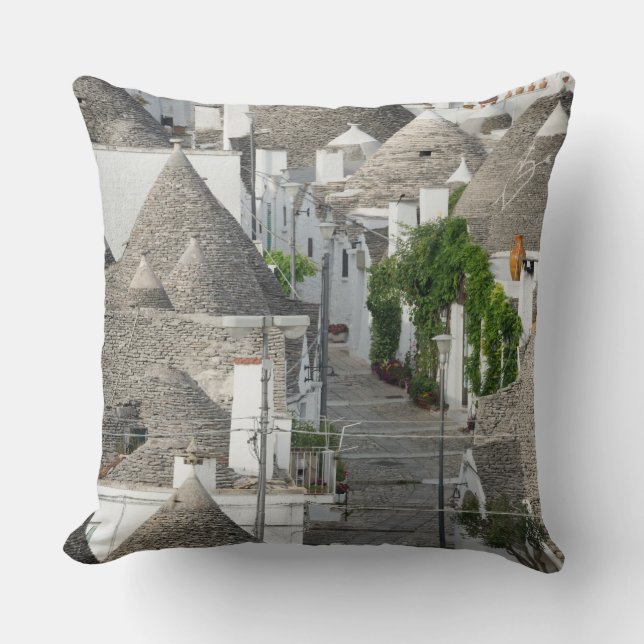 Street with trulli houses in Alberobello, Puglia Throw Pillow (Front)