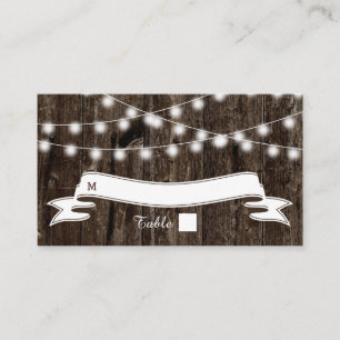String of lights  on old wood wedding place card