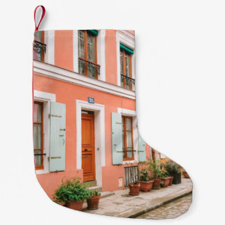 STRUCTURAL PHOTOGRAPHY OF MULTICOLORED BUILDING SMALL CHRISTMAS STOCKING