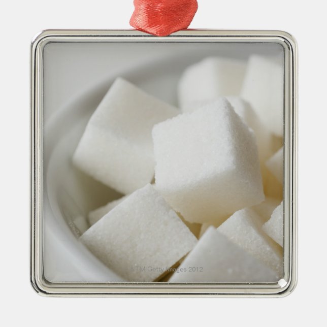 Studio shot of sugar cubes in bowl metal ornament (Front)