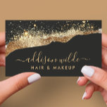 Stunning Black And Gold Glitter Trendy Script Business Card<br><div class="desc">Make a bold and sophisticated statement with this stunning business card. The dramatic black background is accented with a shimmering gold glitter wave pattern, creating a luxurious and eye-catching design. Your name and services are elegantly displayed in a gleaming gold font, ensuring a lasting impression on potential clients. Perfect for...</div>