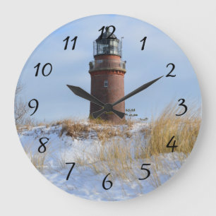 Sturdy Lighthouse on a Rocky Coast in Winter Large Clock
