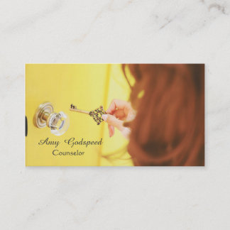 stylish girl looking for a keyhole in the door business card