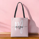 Stylish Pink Modern Script Girly Monogram Name Tote Bag<br><div class="desc">The Stylish Pink Modern Script Girly Monogram Name Tote Bag is the perfect blend of fashion and function. Featuring a soft pink background and a personalized monogram in a modern script font, this tote bag adds a chic, personalized touch to your everyday style. Crafted from durable, high-quality materials, it's spacious...</div>