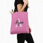 Stylish Pink Personalized Monogram Tote Bag<br><div class="desc">Stylish Pink Personalized Monogram Tote Bag featuring an elegant arrangement of name and monogram initial on a pretty pink background. The bag is easy to personalize by typing the name and initial of your choice into the online personalization template before ordering. The text automatically copies across to the other side...</div>