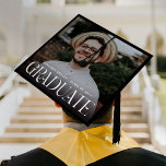 Stylish Typography Overlay Photo Graduate Graduation Cap Topper<br><div class="desc">Transform the pinnacle of academic achievement into a true fashion statement with our minimal yet modern photo graduation cap topper. With a stylish white typography proudly declaring 'GRADUATE', this topper sets you apart from the crowd. Personalize it with your own photo, class year, name, and place of study. This isn't...</div>