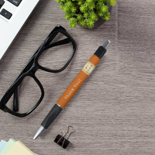 Stylo Brûlé orange logo de la société d'affaires Merci
