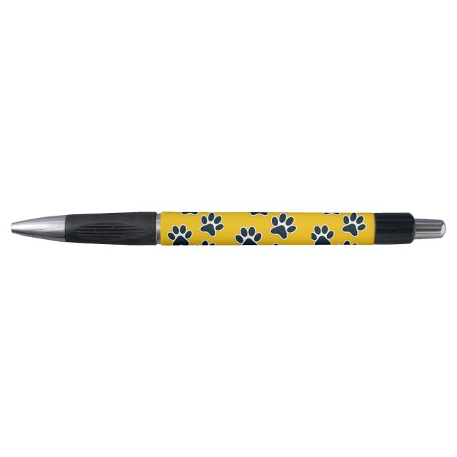Stylo Empreinte de Patte (A playful pen with a yellow body adorned with black paw prints.)