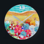 Summer Beach Umbrellas  Round Clock<br><div class="desc">Waves on a sandy beach,  sunbathers under colorful umbrellas,  this clock is a fun addition to your beach house or summer decor or give as a gift. MATCHING items in our store.</div>