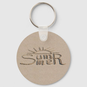Summer sign carved on the beach sand keychain