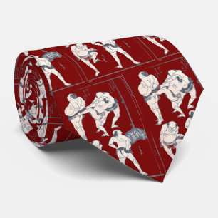 Sumo wrestlers in preparation tie