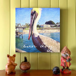 Sun Day Cute Ocean Beach Pier Pelican Bird Photo Canvas Print<br><div class="desc">This happy pelican perched on a railing overlooking a California beach screams “vacation ready”. Imagine the ocean breezes as you gaze at this photo canvas print. You can easily personalize this wall art plus I also offer customization on any product. IMPORTANT NOTE: Please do not change the size on this...</div>