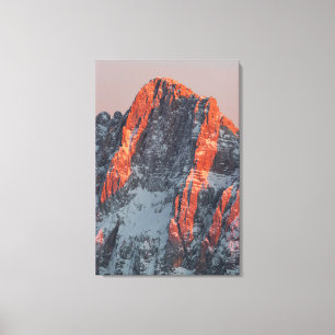 Sun light on snowy mountains canvas print