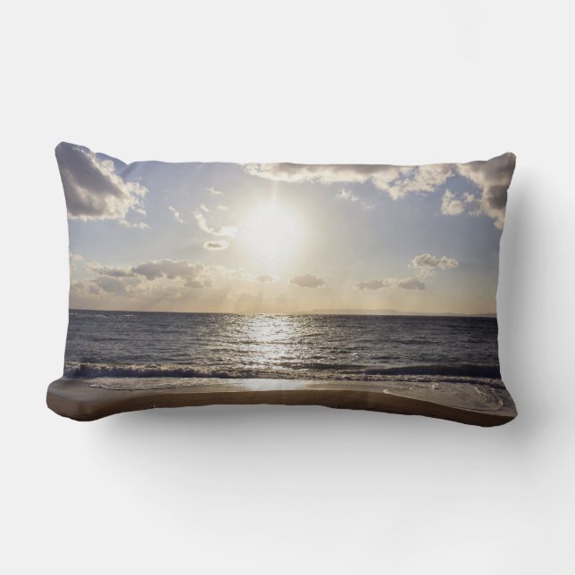 Sun pierces the blue sky on a deserted beach lumbar pillow (Front)
