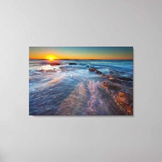 Sun rays illuminate the Pacific Ocean Canvas Print (Front)
