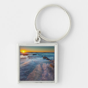 Sun rays illuminate the Pacific Ocean Keychain