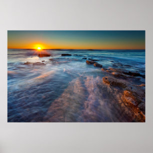 Sun rays illuminate the Pacific Ocean Poster