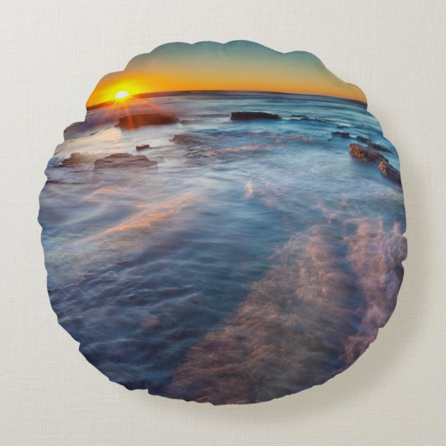 Sun rays illuminate the Pacific Ocean Round Pillow (Front)