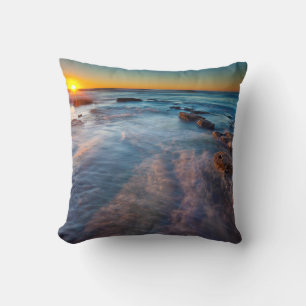 Sun rays illuminate the Pacific Ocean Throw Pillow