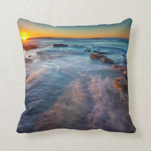 Sun rays illuminate the Pacific Ocean Throw Pillow