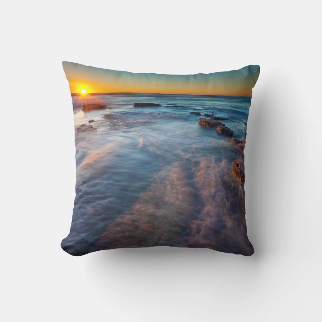 Sun rays illuminate the Pacific Ocean Throw Pillow (Front)