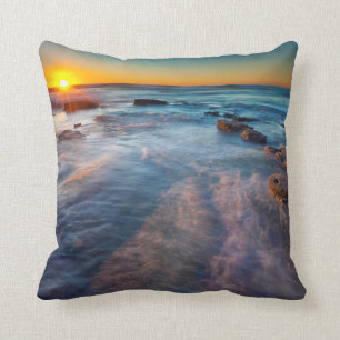 Sun rays illuminate the Pacific Ocean Throw Pillow