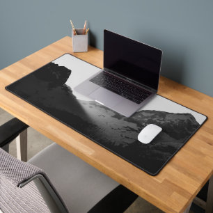 Sun rays over the mountains desk mat