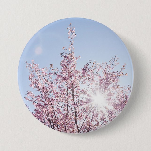 sun rays pass through pink flowers of a wow tree 3 inch round button (Front)