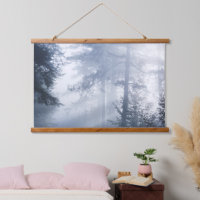 Sun rays shinning through foggy forest