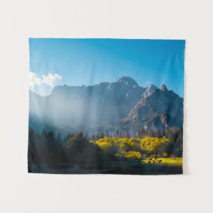 Sun rising on horses at lake Fusine, Italy Tapestry