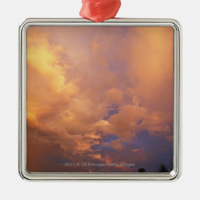Sun setting behind clouds metal ornament (Front)
