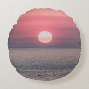 SUN SETTING ON OCEAN HORIZON ROUND PILLOW