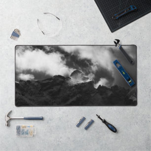 Sun shining on majestic mountain desk mat