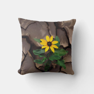 Sunflower growing from Cracked Mud Throw Pillow