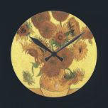 Sunflowers by Van Gogh Round Clock<br><div class="desc">Still Life: Vase with Fifteen Sunflowers Painting by Vincent van Gogh For expressionism is not simply a way of seeing things: it is also a way of making them, of painting them. An expressionist does not paint "flat" and in pure tones--he breaks up his tones and applies them with a...</div>
