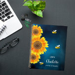 Sunflowers yellow bees blue sky name  planner<br><div class="desc">Get ready to organize your days with a touch of natural charm with our Personalized Sunflower and Bee Spiral Planner. This delightful planner features a serene dark blue sky background adorned with vibrant watercolored sunflowers and cheerful smiling bees, bringing a sense of joy and whimsy to your daily planning. Serene...</div>