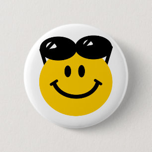 Sunglasses perched on top of head face 2 inch round button