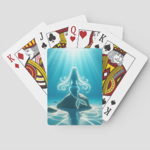 Sunlit, underwater mermaid playing cards