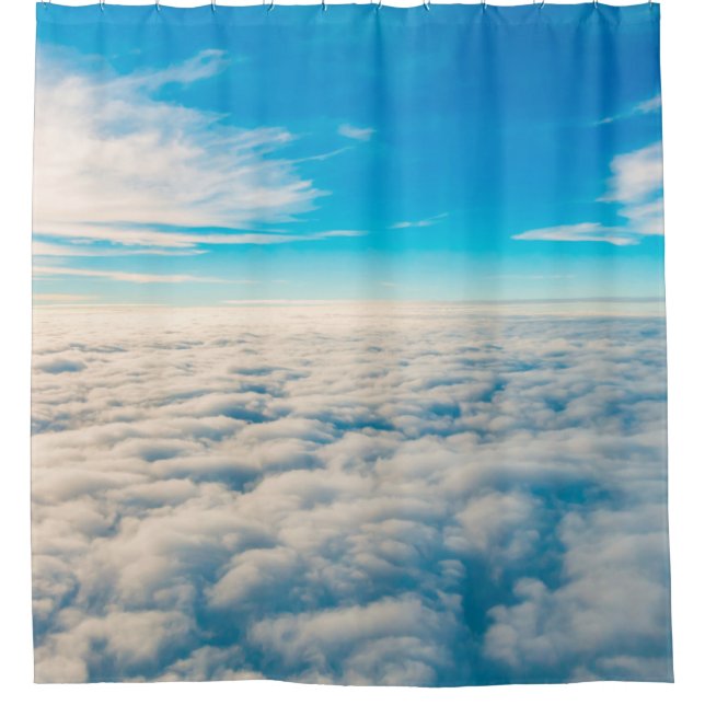 Sunrise above clouds from airplane window (Front)
