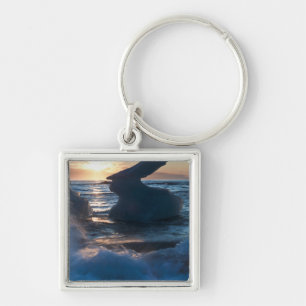Sunrise and iceberg formation on the beach keychain