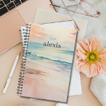 Sunrise Beach | Pretty Personalized Yearly Planner<br><div class="desc">Stay organized and inspired with our customizable planner featuring a tropical beach design with a soft sunrise beach scene on both the front and back covers. Personalize it with your name and the year for a planner that's uniquely yours. With ample space for scheduling, note-taking, and goal-setting, this planner is...</div>