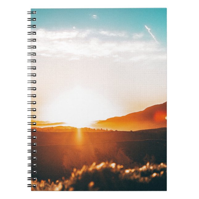 sunrise over a mountain notebook (Front)