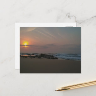 Sunrise over a rockpool at the seaside postcard