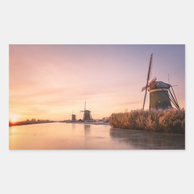 Sunrise over frozen river with windmills and reeds sticker (Front)