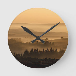 Sunrise Over Misty Rolling Hills Landscape Round Clock