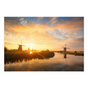 Sunrise over windmills and a river in Holland Photo Print