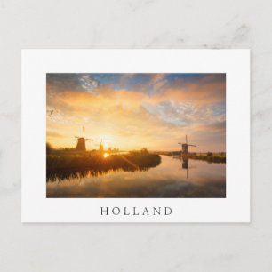 Sunrise over windmills and a river in Holland Postcard