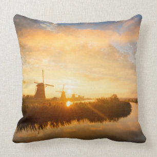 Sunrise over windmills and a river in Holland Throw Pillow