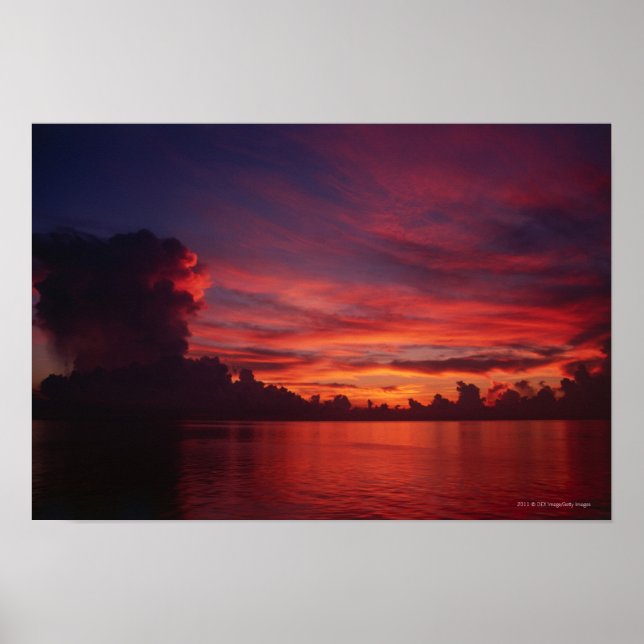 Sunset at sea with dark clouds poster (Front)