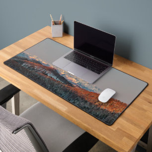Sunset at spruce forest and mountains. desk mat